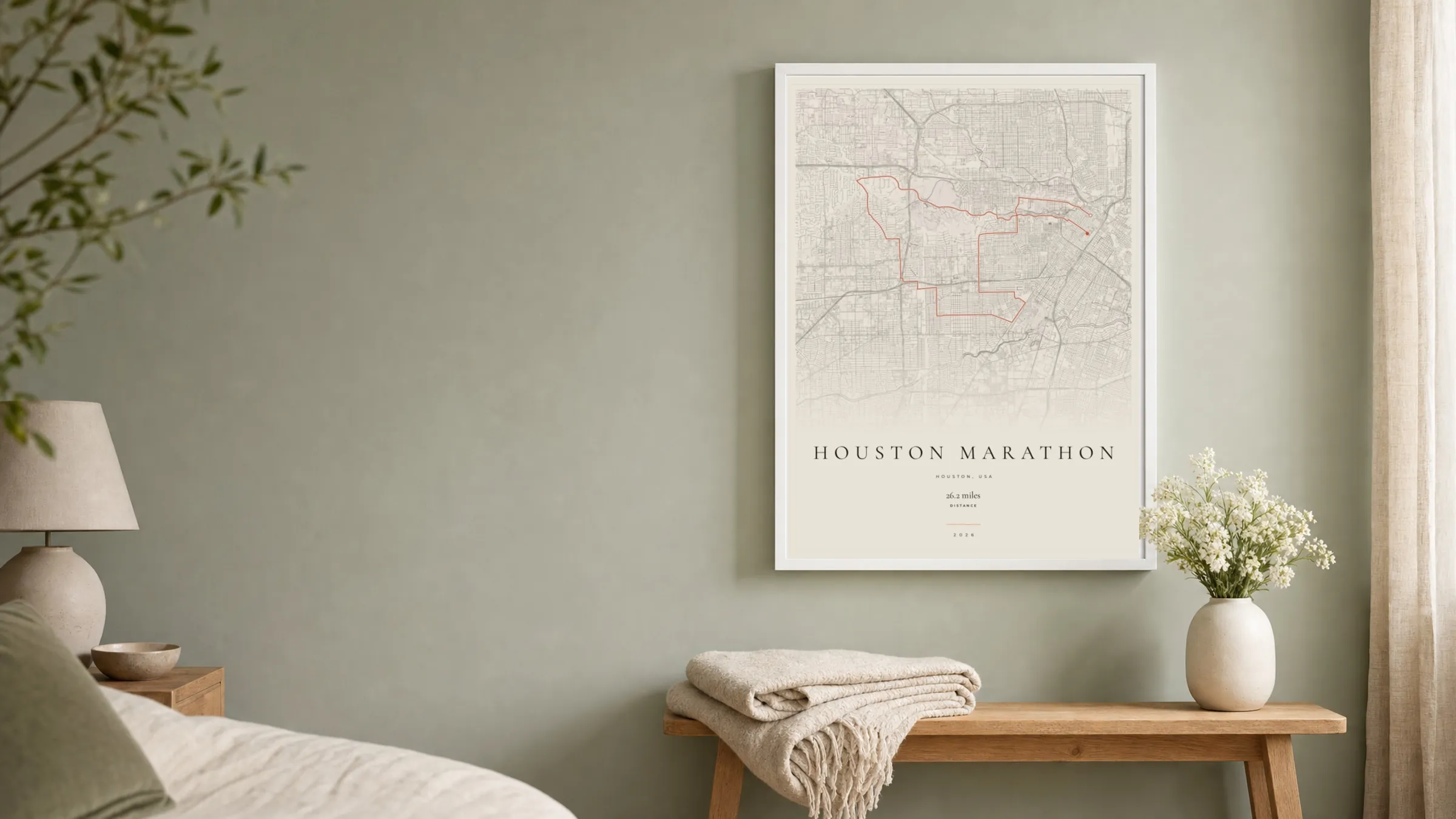 Houston Marathon 2026 Gallery Mono route print in a white frame on a sage bedroom wall