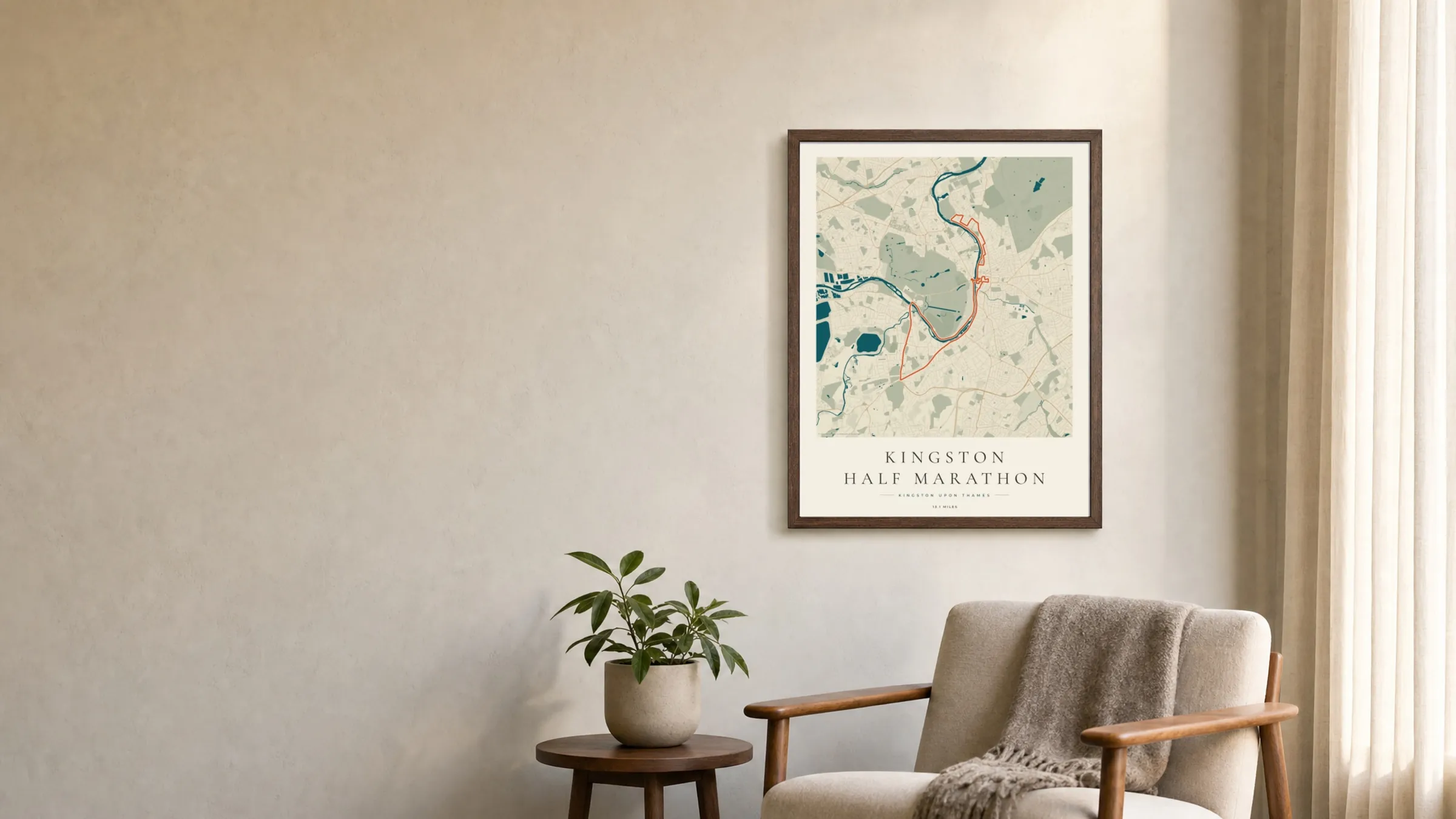 Kingston Half Marathon 2025 Coastal Atlas route print in a dark walnut frame on a living-room wall