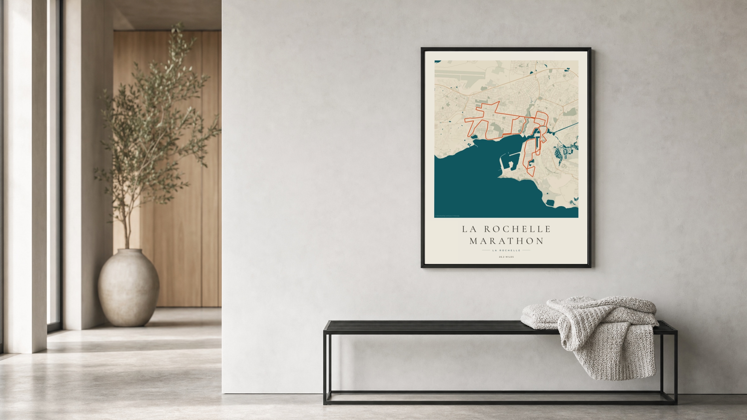 La Rochelle Marathon 2025 Coastal Atlas route print in a black frame in a bright hallway