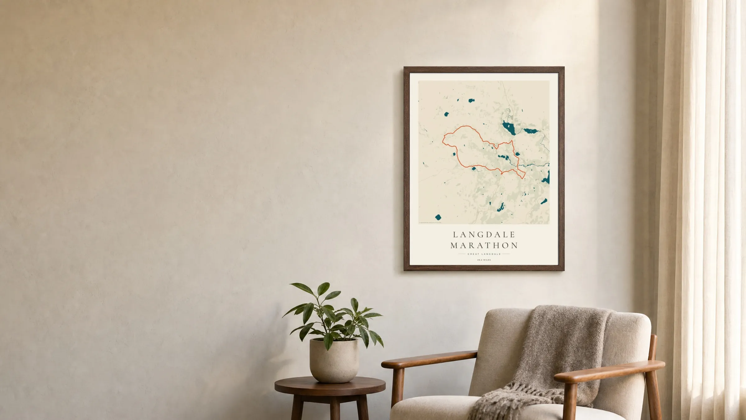 Langdale Marathon 2025 Coastal Atlas route print in a dark walnut frame on a living-room wall