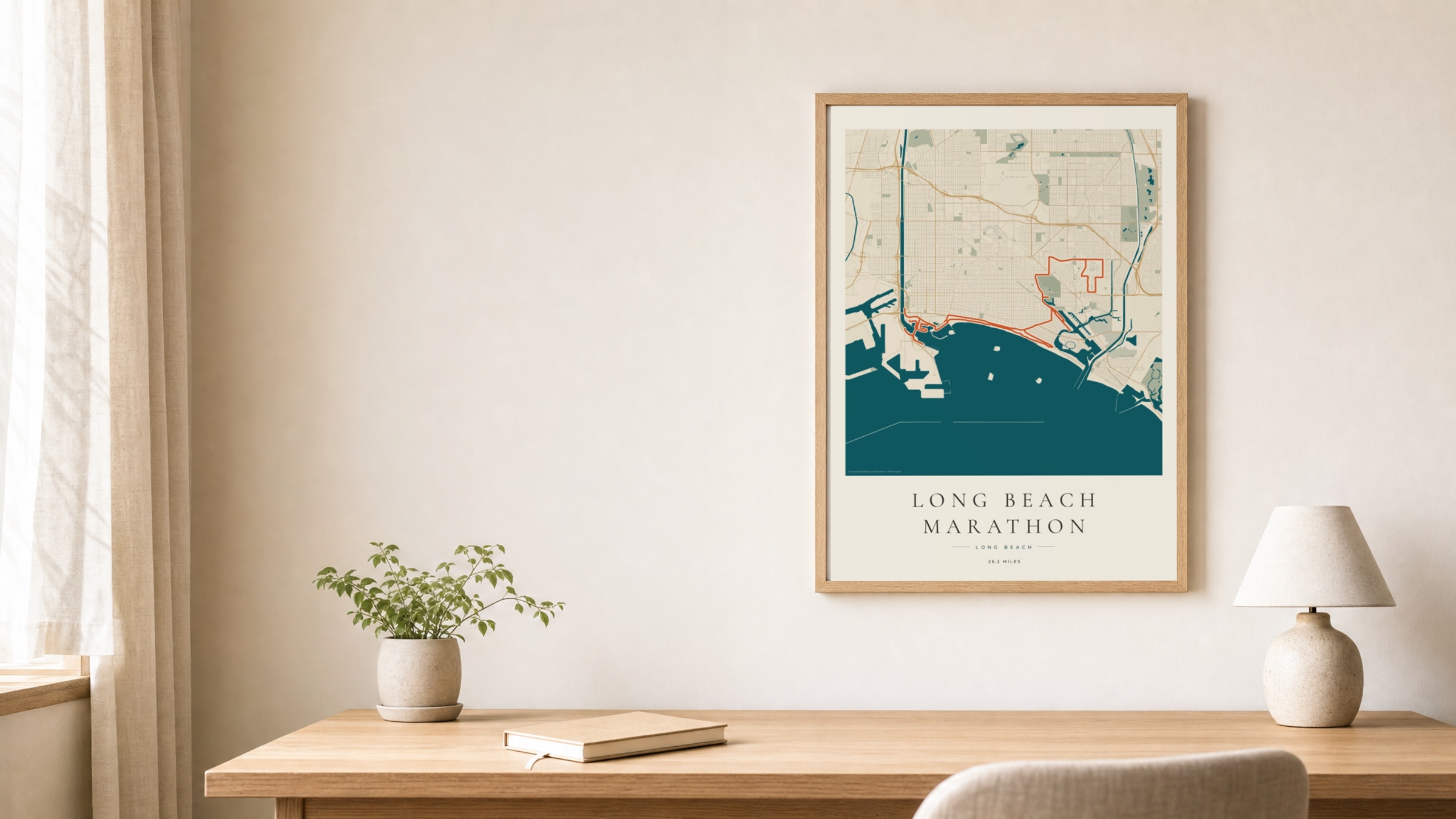 Long Beach Marathon 2026 Coastal Atlas route print in an oak frame above a study desk