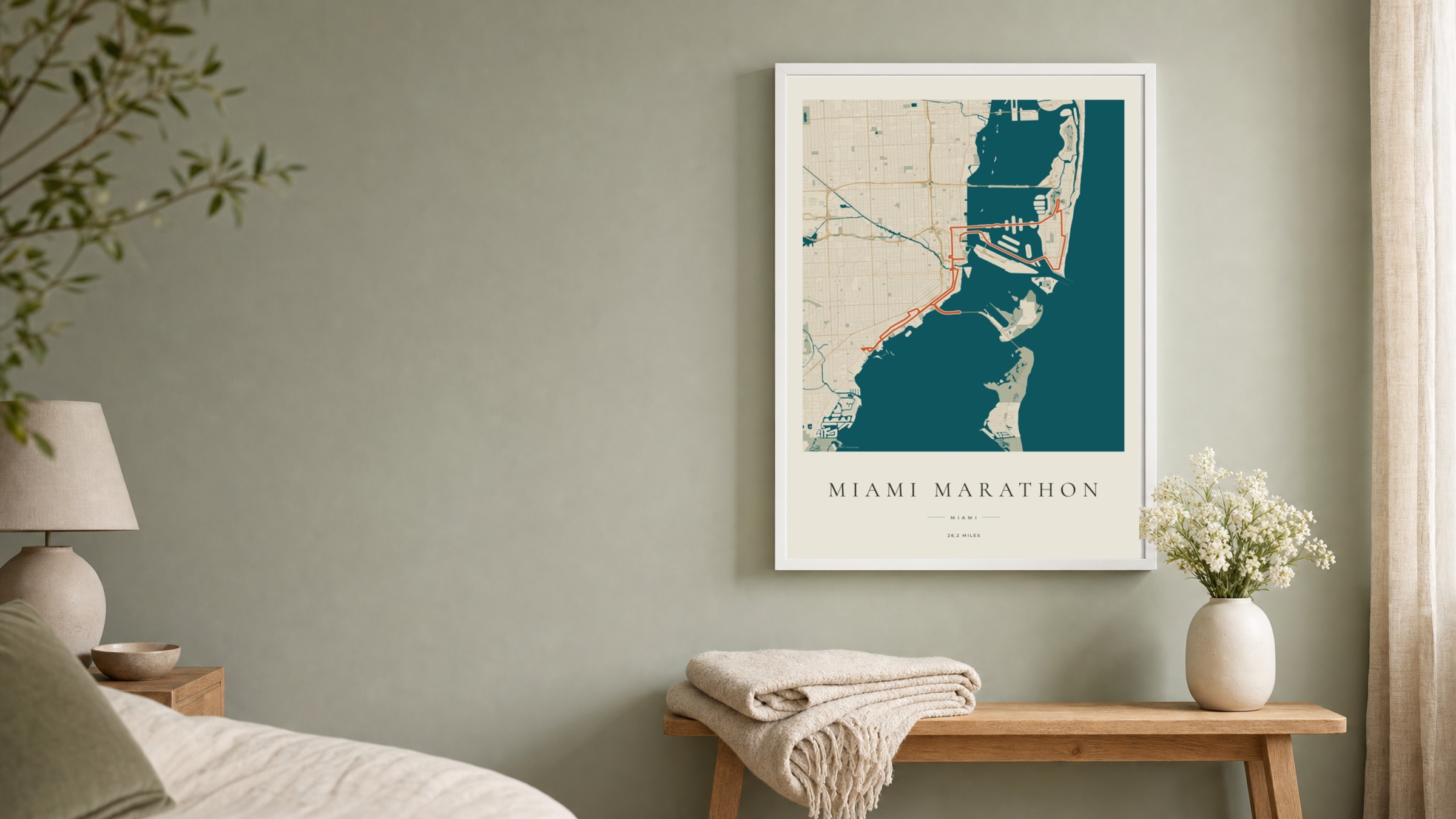 Miami Marathon 2026 Coastal Atlas route print in a white frame on a sage bedroom wall