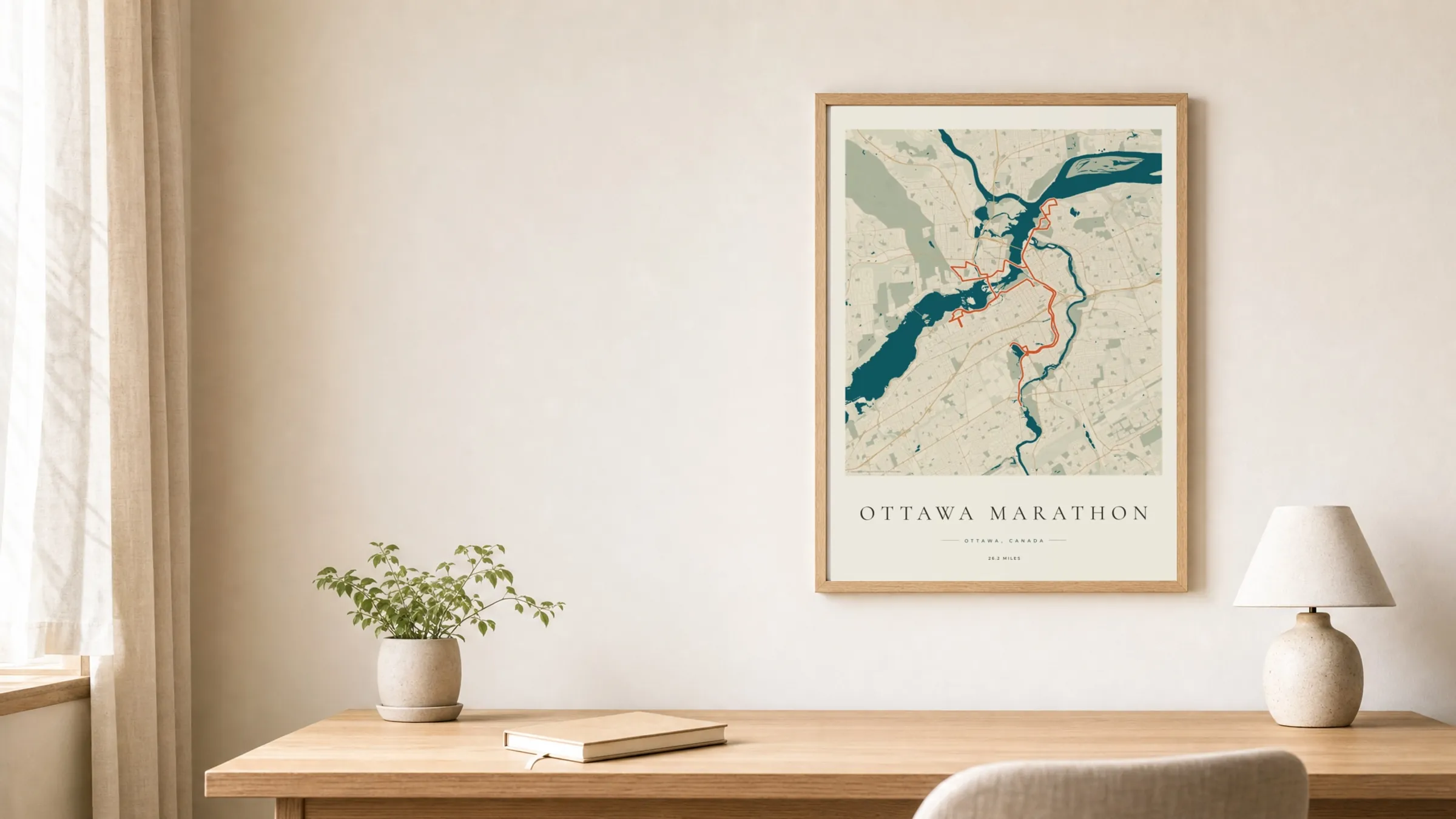 Ottawa Marathon 2026 Coastal Atlas route print in an oak frame above a study desk