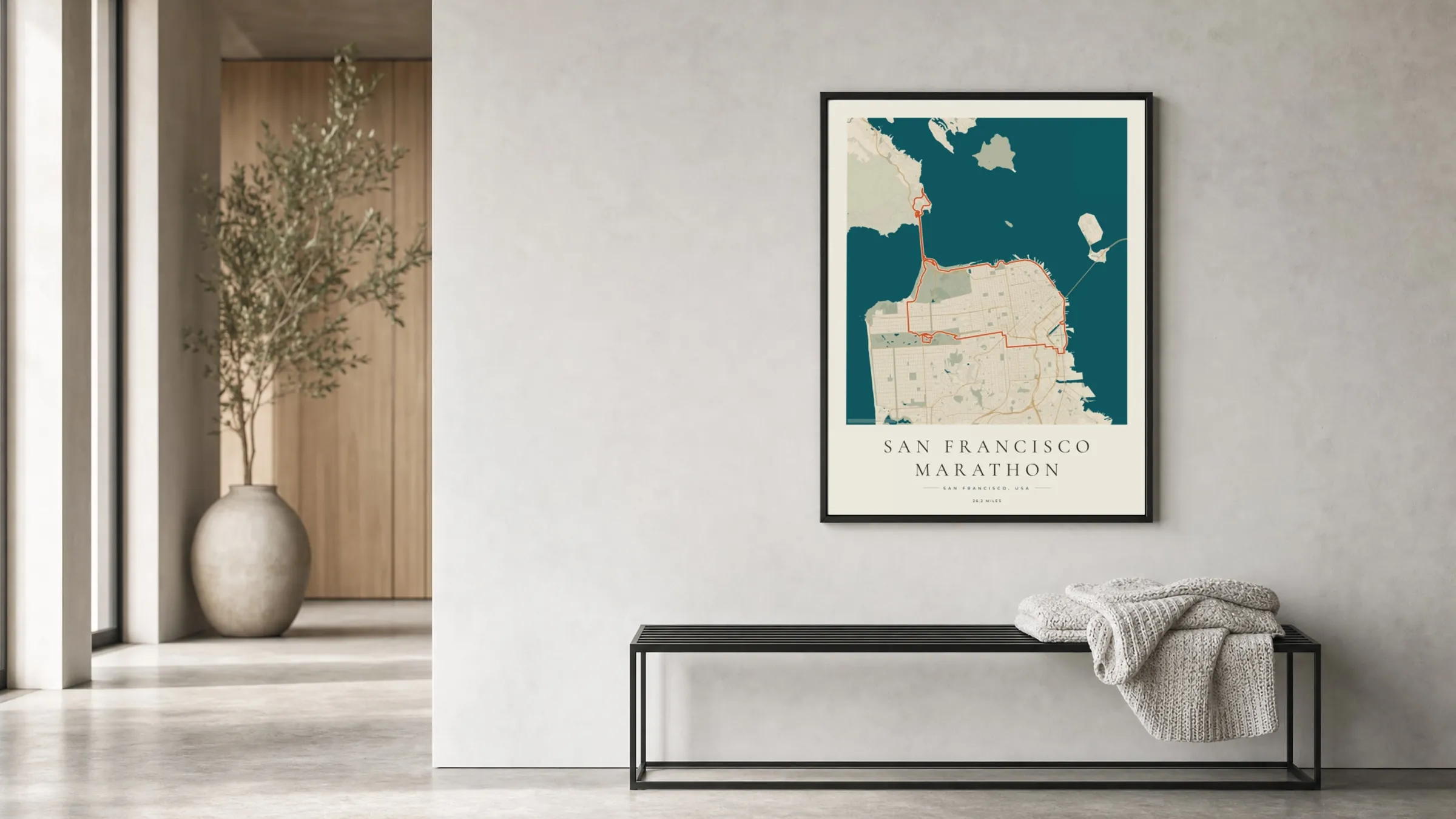 San Francisco Marathon 2026 Coastal Atlas route print in a black frame in a bright hallway