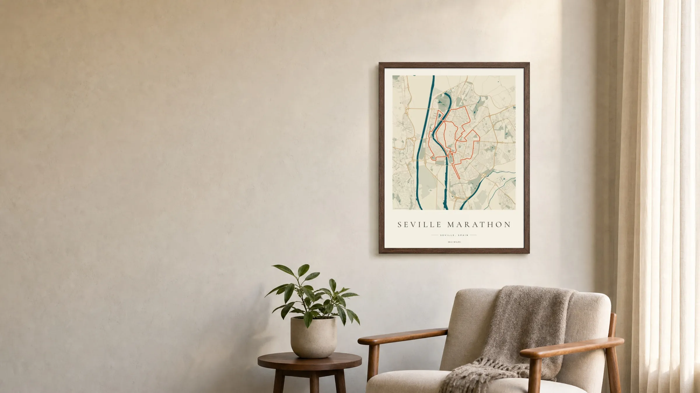 Seville Marathon 2025 Coastal Atlas route print in a dark walnut frame on a living-room wall
