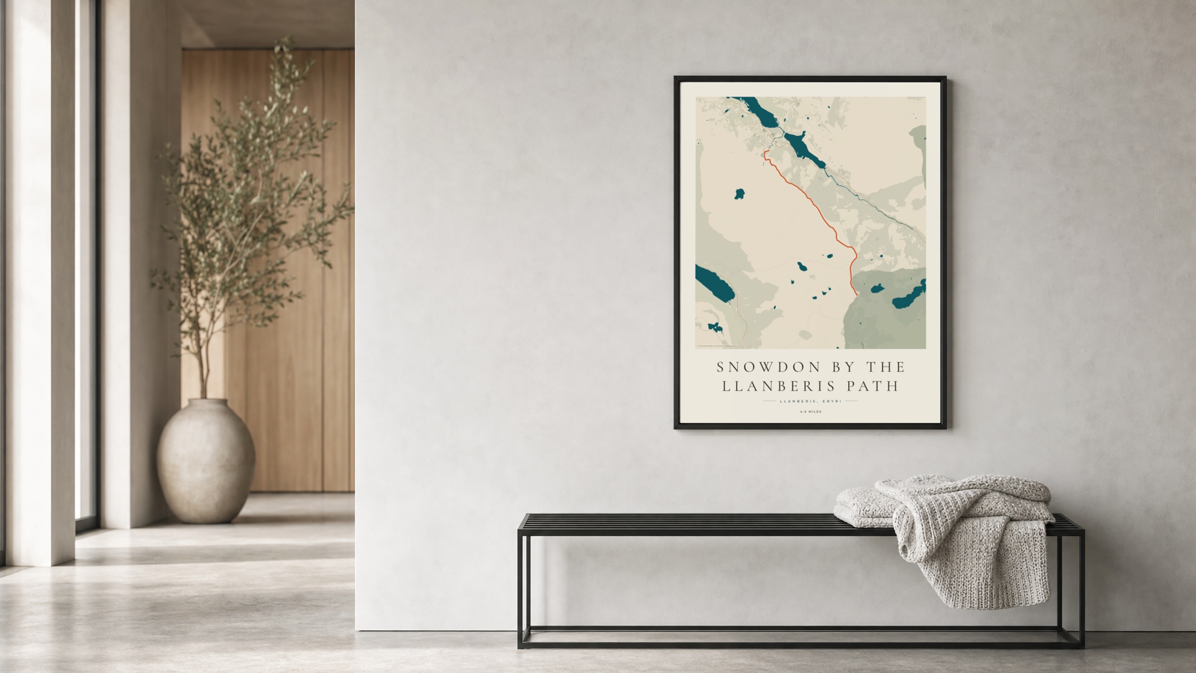 Snowdon Coastal Atlas route print in a black frame in a bright hallway