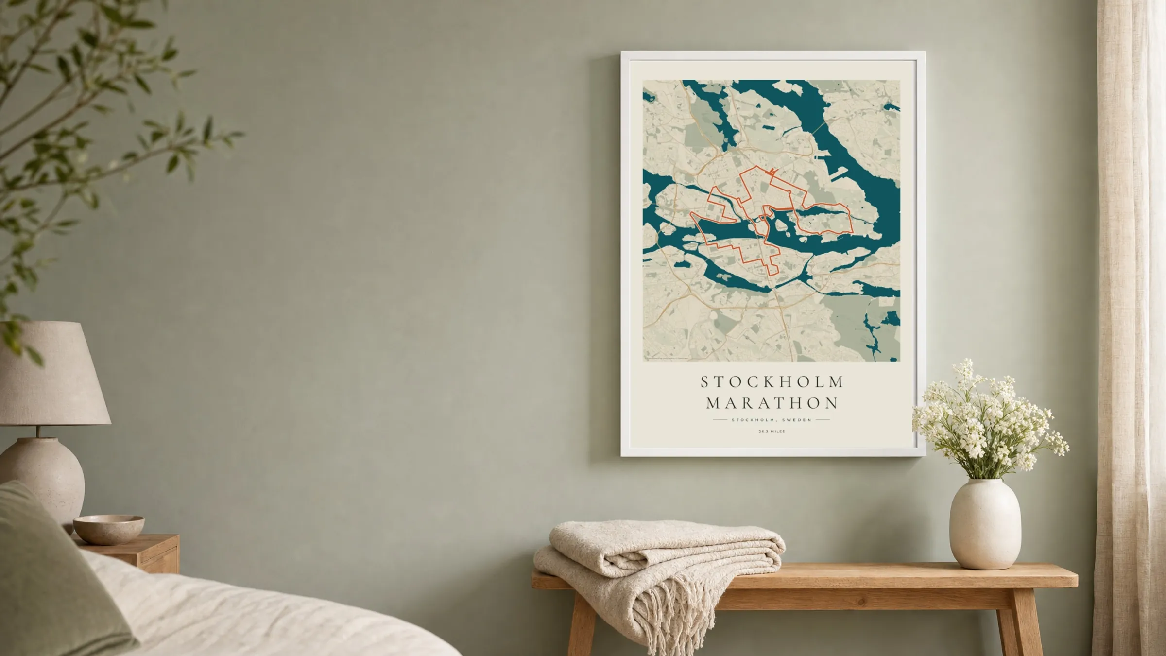 Stockholm Marathon 2026 Coastal Atlas route print in a white frame on a sage bedroom wall