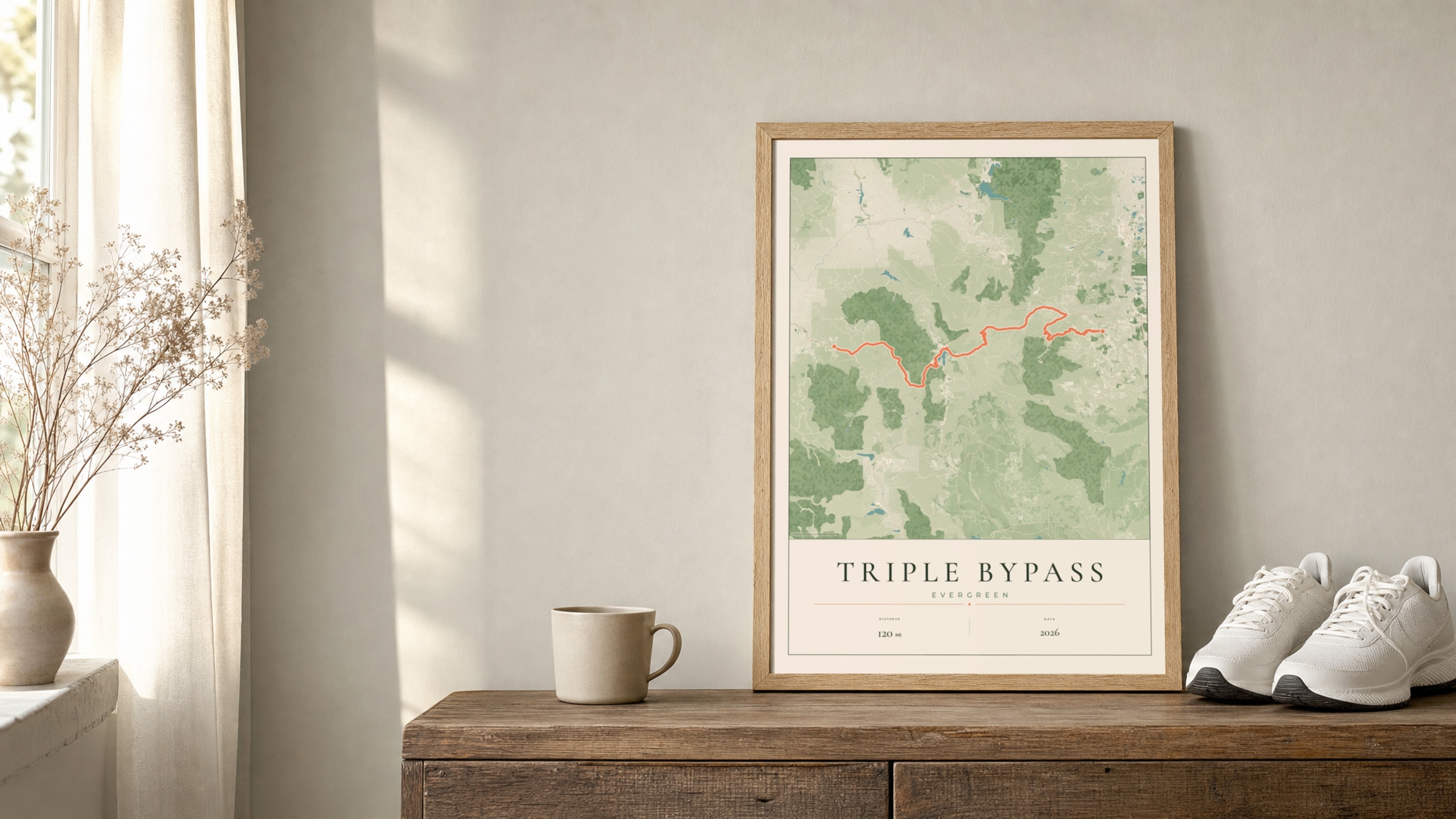 Triple Bypass 2026 Parkland route print in an oak frame on a sideboard beside running shoes