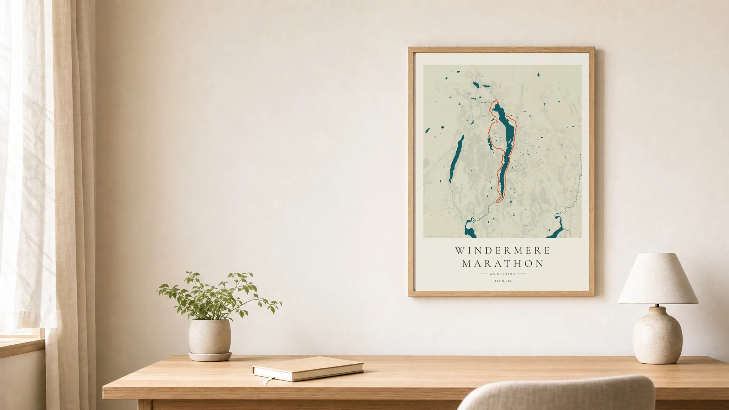 Windermere Marathon 2026 Coastal Atlas route print in an oak frame above a study desk